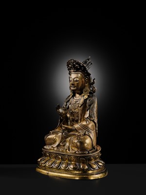 Lot 28 - A TWO-TONE GILT COPPER-ALLOY FIGURE OF GUANYIN, KANGXI-YONGZHENG PERIOD