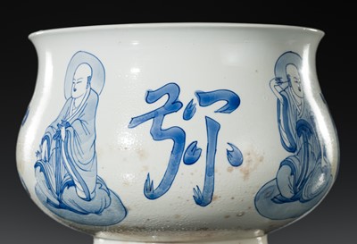 AN INSCRIBED BLUE AND WHITE ‘LUOHAN’ CENSER, KANGXI PERIOD