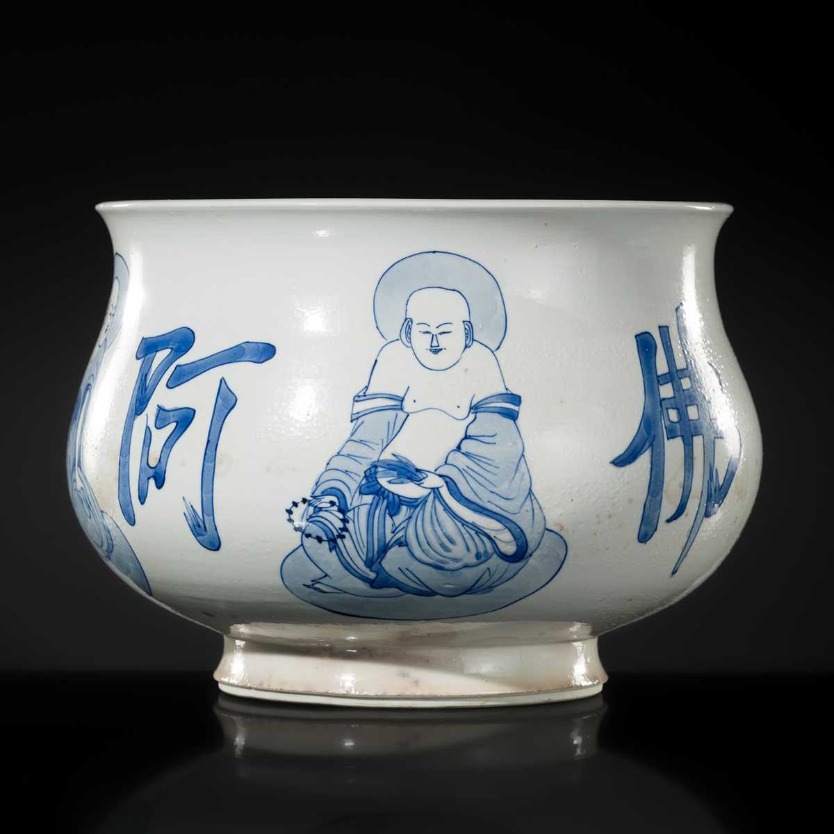 AN INSCRIBED BLUE AND WHITE ‘LUOHAN’ CENSER, KANGXI PERIOD