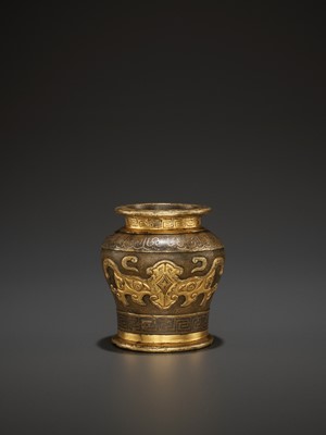 Lot 435 - AN ARCHAISTIC PARCEL-GILT BRONZE JARLET BY HU WENMING, LATE MING