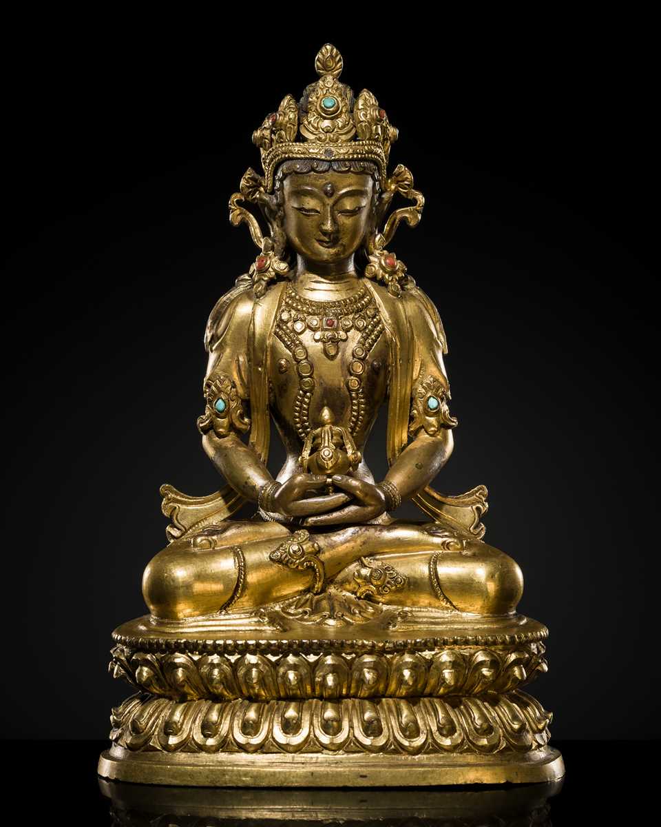 Lot 29 - A FINELY INLAID GILT-BRONZE FIGURE OF AMITAYUS, EARLY QING DYNASTY