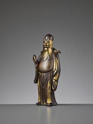 Lot 506 - A PARCEL-GILT BRONZE FIGURE OF SHOULAO, 17TH CENTURY