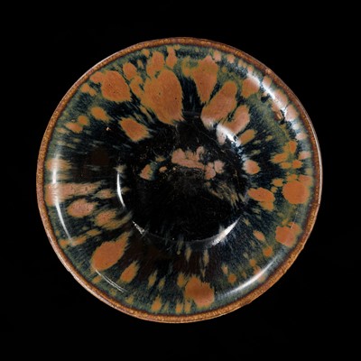 Lot 148 - A FINE HENAN RUSSET-SPLASHED AND BLACK-GLAZED 'PARTRIDGE FEATHER' BOWL, NORTHERN SONG TO JIN DYNASTY