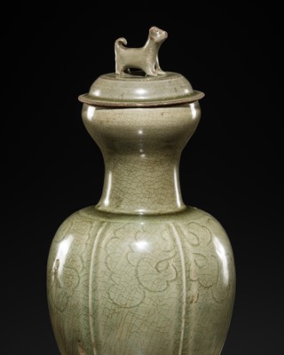 Lot 147 - A RARE CARVED LONGQUAN CELADON VASE AND COVER, NORTHERN SONG DYNASTY