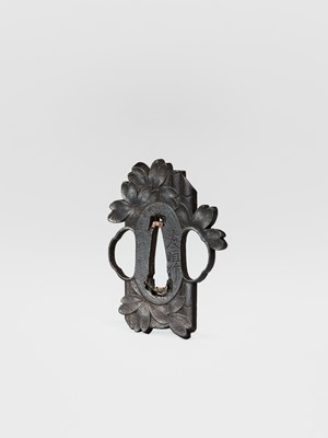 Lot 59 - NAKAI TOMOTSUNE: A RARE CHOSHU SCHOOL IRON TSUBA WITH SAKURA AND BAMBOO