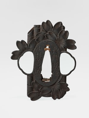 Lot 59 - NAKAI TOMOTSUNE: A RARE CHOSHU SCHOOL IRON TSUBA WITH SAKURA AND BAMBOO