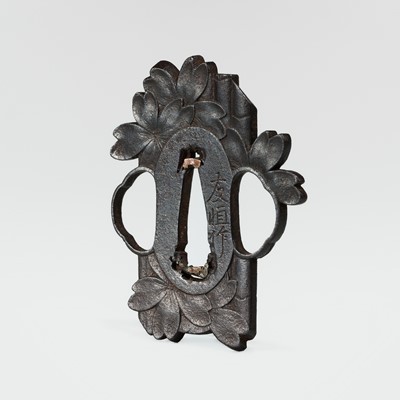 Lot 59 - NAKAI TOMOTSUNE: A RARE CHOSHU SCHOOL IRON TSUBA WITH SAKURA AND BAMBOO