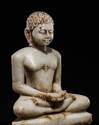 Lot 619 - A JAIN WHITE MARBLE FIGURE OF A TIRTHANKARA, GUJARAT, 17TH-18TH CENTURY OR EARLIER