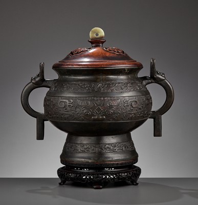 Lot 437 - AN ARCHAISTIC BRONZE GUI-FORM CENSER, QING DYNASTY