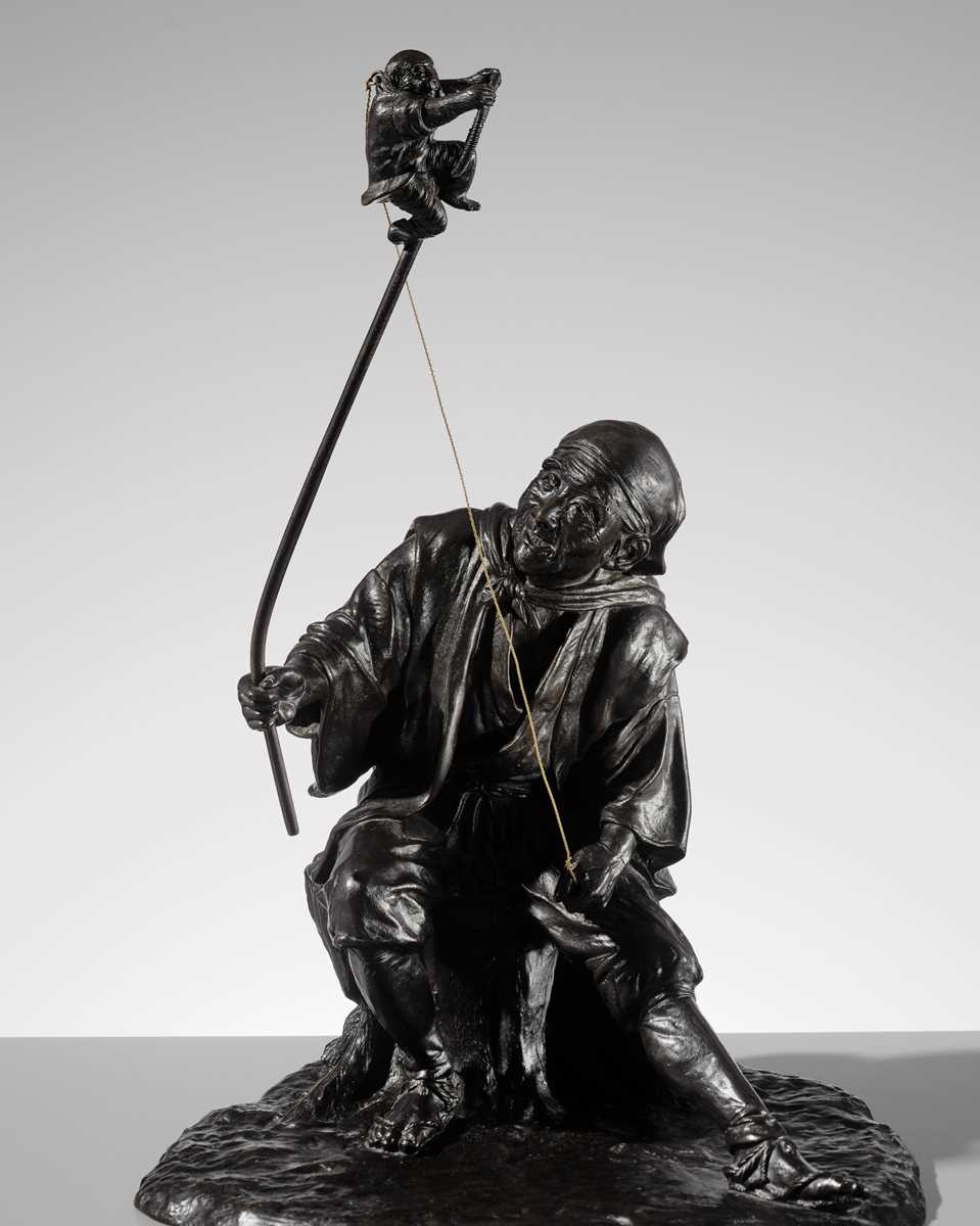 Lot 1 - GENRYUSAI SEIYA: A HUMOROUS AND LARGE BRONZE OKIMINO OF A SARUMAWASHI WITH MONKEY
