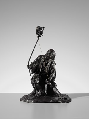 Lot 1 - GENRYUSAI SEIYA: A HUMOROUS AND LARGE BRONZE OKIMINO OF A SARUMAWASHI WITH MONKEY