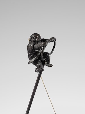 Lot 1 - GENRYUSAI SEIYA: A HUMOROUS AND LARGE BRONZE OKIMINO OF A SARUMAWASHI WITH MONKEY