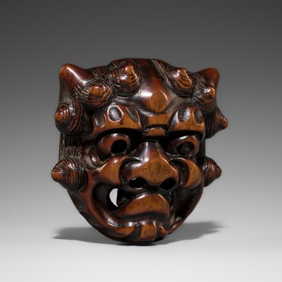 Lot 550 - A WOOD MASK NETSUKE OF AN ONI