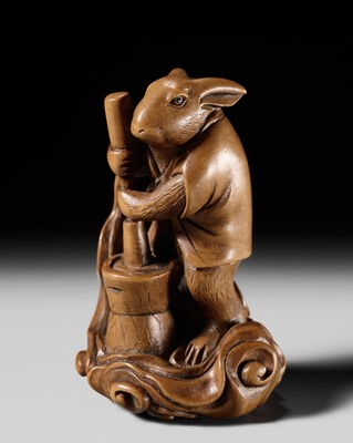 Lot 265 - SHOUN: A FINE WOOD NETSUKE OF A LUNAR HARE POUNDING MOCHI