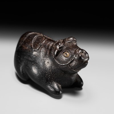 Lot 165 - MASATOSHI: A FINE NAGOYA SCHOOL EBONY WOOD NETSUKE OF A RECUMBENT OX