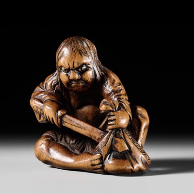 Lot 255 - KINSAI: A WOOD NETSUKE OF YOJO STABBING THE KING’S CLOAK