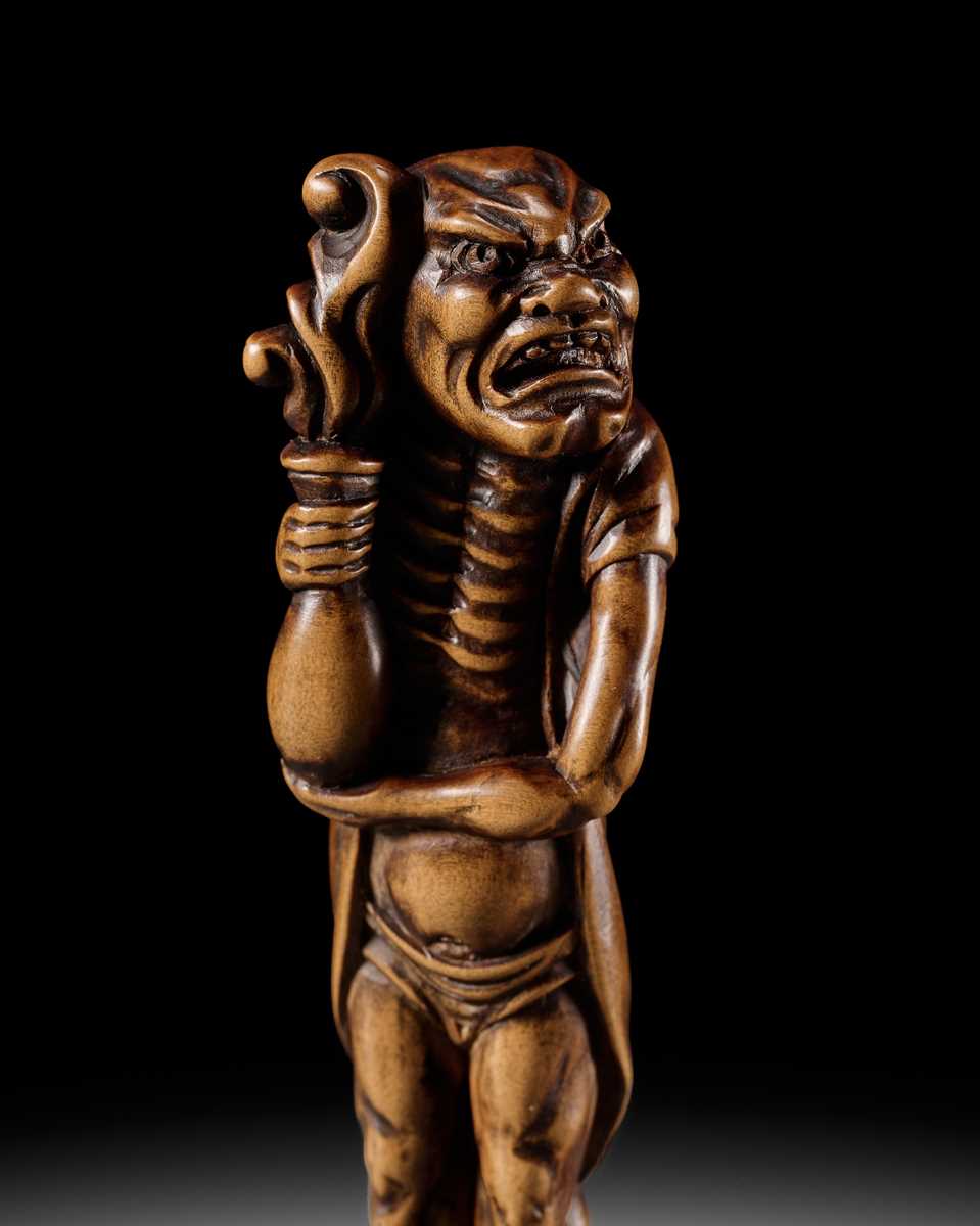 Lot 87 - A SUPERB TALL WOOD NETSUKE OF RYUJIN’S ATTENDANT