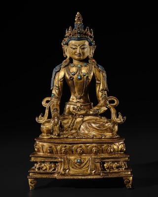 Lot 14 - A GILT COPPER ALLOY FIGURE OF BUDDHA AKSHOBHYA, PROBABLY JONANG LINEAGE, TIBET, 14TH-15TH CENTURY