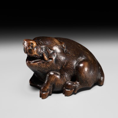 Lot 203 - MASANAO: A GOOD WOOD NETSUKE OF A RECUMBENT BOAR