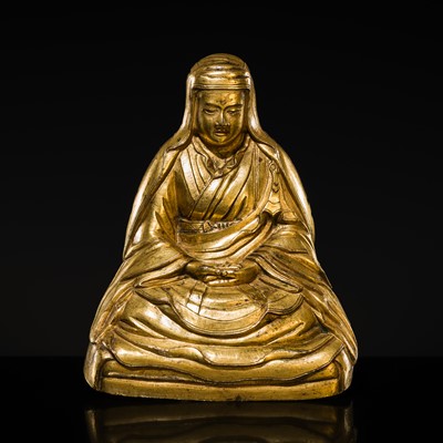 Lot 314 - AN INSCRIBED GILT COPPER ALLOY FIGURE OF THE ARHAT AJITA, TIBET, 17TH CENTURY
