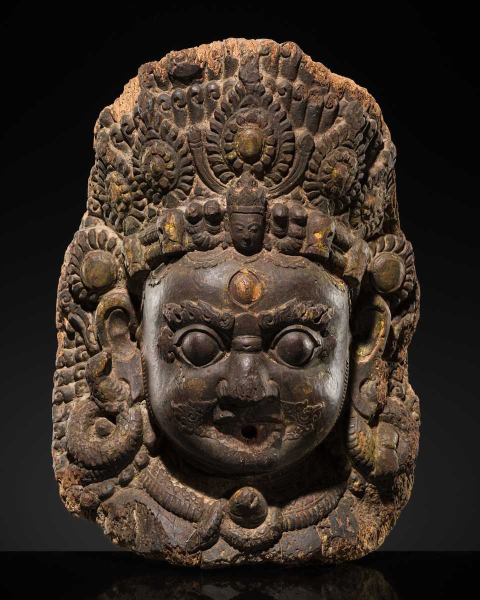 Lot 22 - A WOOD MASK DEPICTING BHAIRAVA, NEPAL, 16TH-17TH CENTURY
