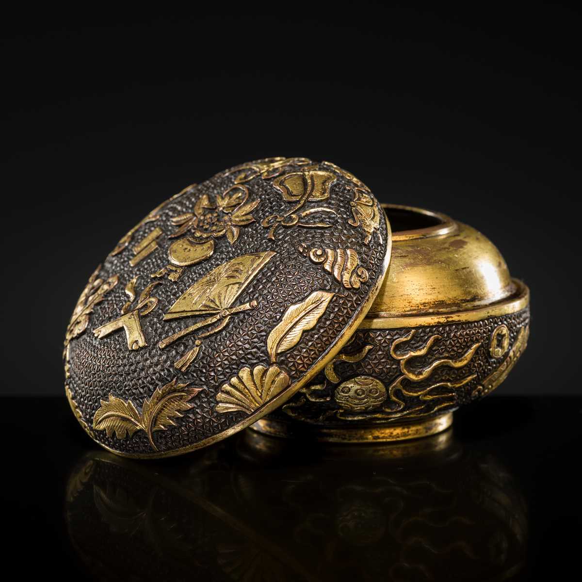 A FINE PARCEL-GILT BRONZE INCENSE POWDER BOX AND COVER, MING DYNASTY