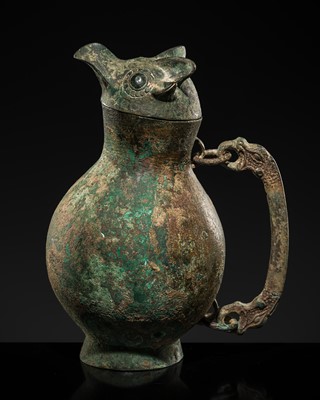 Lot 89 - A RARE ARCHAIC BRONZE OWL-HEADED RITUAL WINE VESSEL, HU, EASTERN ZHOU DYNASTY, 8TH-3RD CENTURY BC