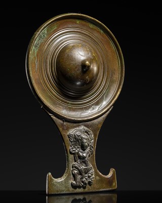 Lot 656 - A BRONZE MIRROR DEPICTING A GODDESS, EASTERN JAVANESE PERIOD, 11TH CENTURY