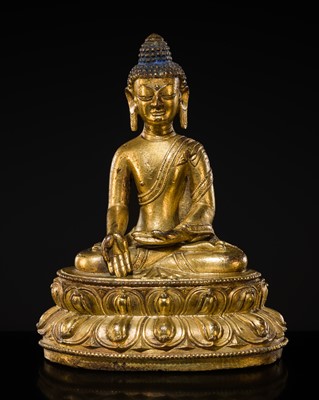 Lot 302 - A GILT-BRONZE FIGURE DEPICTING BUDDHA RATNASAMBHAVA, TIBET, 15TH CENTURY