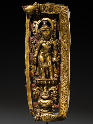 A GILT-COPPER REPOUSSÉ RELIEF DEPICTING PADMAPANI LOKESHVARA, TIBET, 14TH-15TH CENTURY