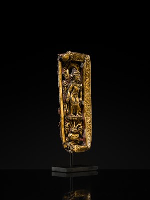 A GILT-COPPER REPOUSSÉ RELIEF DEPICTING PADMAPANI LOKESHVARA, TIBET, 14TH-15TH CENTURY
