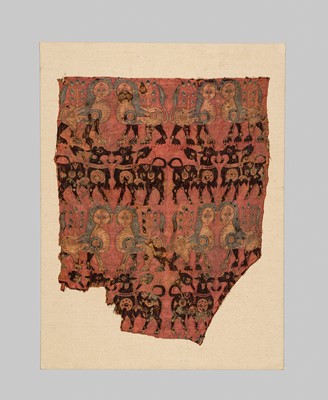 Lot 197 - AN ANCIENT AND VERY RARE SILK FRAGMENT WITH CONFRONTING LIONS AND BULLS, SOGDIANA, CIRCA 650 AD