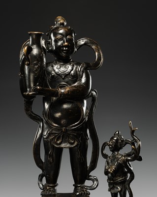 Lot 356 - A ‘SHANCAI TONGZI’ BRONZE JOSS STICK HOLDER, MING DYNASTY