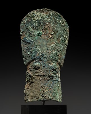 Lot 368 - A BRONZE ‘HUMANOID MASK’ AXE, WESTERN ZHOU DYNASTY, 11TH CENTURY BC