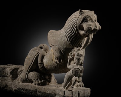 Lot 207 - A SANDSTONE CARVING OF A LION SUBDUING A WARRIOR, CHANDELA DYNASTY