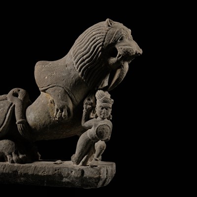 Lot 207 - A SANDSTONE CARVING OF A LION SUBDUING A WARRIOR, CHANDELA DYNASTY