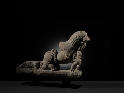 Lot 207 - A SANDSTONE CARVING OF A LION SUBDUING A WARRIOR, CHANDELA DYNASTY