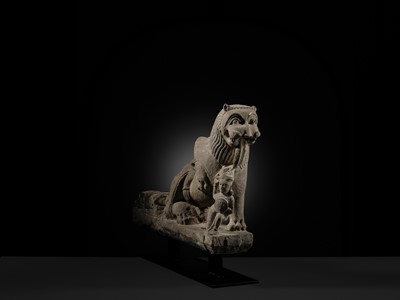 Lot 207 - A SANDSTONE CARVING OF A LION SUBDUING A WARRIOR, CHANDELA DYNASTY
