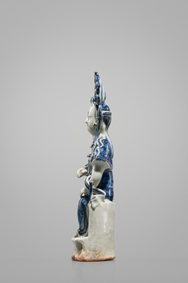 Lot 1585 - AN UNDERGLAZE BLUE PORCELAIN FIGURE OF KANNON BOSATSU