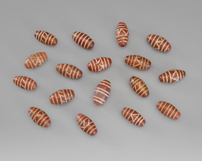 Lot 1511 - A LOT WITH SEVENTEEN PYU CARNELIAN AGATE BEADS, 7TH-9TH CENTURY