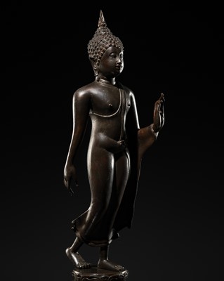 Lot 438 - A FINE SUKHOTHAI STYLE BRONZE FIGURE OF THE WALKING BUDDHA, 18TH-19TH CENTURY