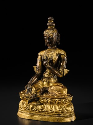 A FINE GILT BRONZE REPOUSSÉ FIGURE OF KHADIRAVANI TARA