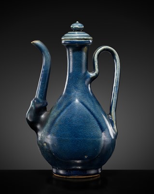 Lot 511 - A BLUE-GLAZED EWER AND COVER, MING DYNASTY, 16TH CENTURY
