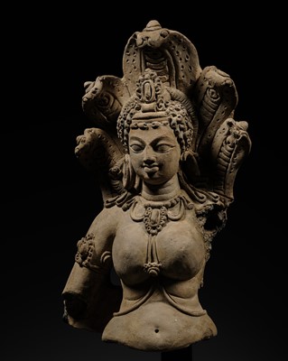 Lot 208 - A TERRACOTTA BUST OF MANASA, THE SERPENT GODDESS, EASTERN INDIA, GUPTA PERIOD, EARLY 6TH CENTURY