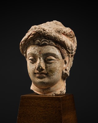 Lot 291 - A POLYCHROME STUCCO HEAD OF A TURBANED BODHISATTVA, ANCIENT REGION OF GANDHARA, 4TH CENTURY