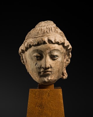 Lot 292 - A POLYCHROME STUCCO HEAD OF A BODHISATTVA, ANCIENT REGION OF GANDHARA, 4TH CENTURY