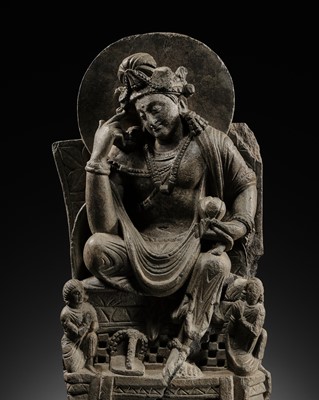 Lot 228 - A GRAY SCHIST FIGURE OF A PENSIVE BODHISATTVA, ANCIENT REGION OF GANDHARA, 2ND-3RD CENTURY