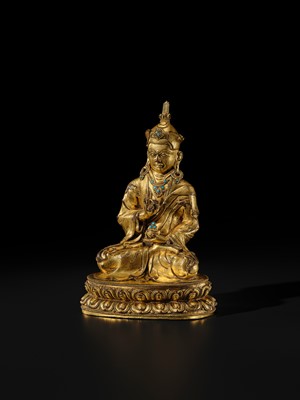 Lot 18 - A GILT BRONZE FIGURE OF PADMASAMBHAVA, TIBET, 16TH-17TH CENTURY
