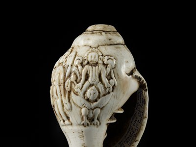 Lot 4 - A RITUAL CONCH SHELL DEPICTING VISHNU AND GARUDA, NEPAL, 11TH CENTURY