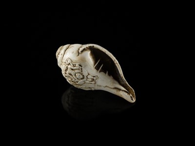 Lot 4 - A RITUAL CONCH SHELL DEPICTING VISHNU AND GARUDA, NEPAL, 11TH CENTURY